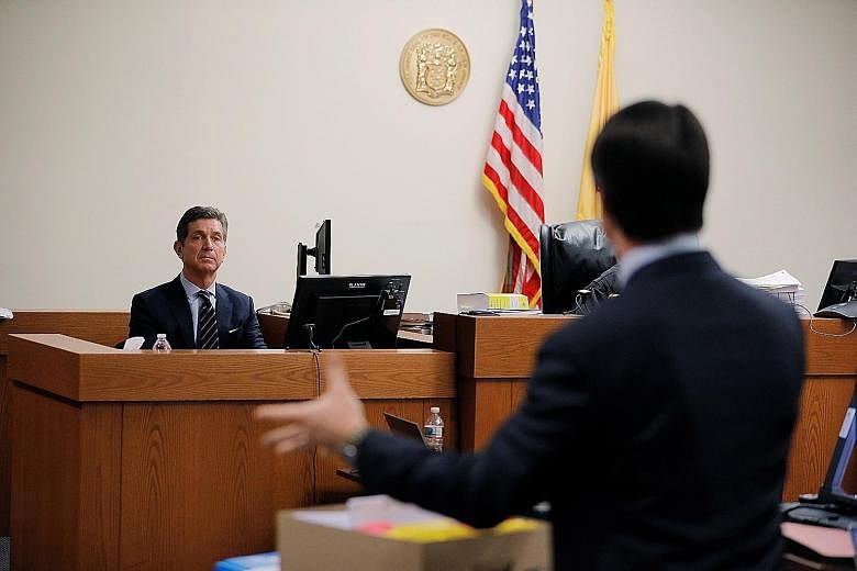 J&J CEO Alex Gorsky testifying in court in New Jersey. The company faces over 16,000 lawsuits alleging it sold powders contaminated with asbestos and failed to warn users.