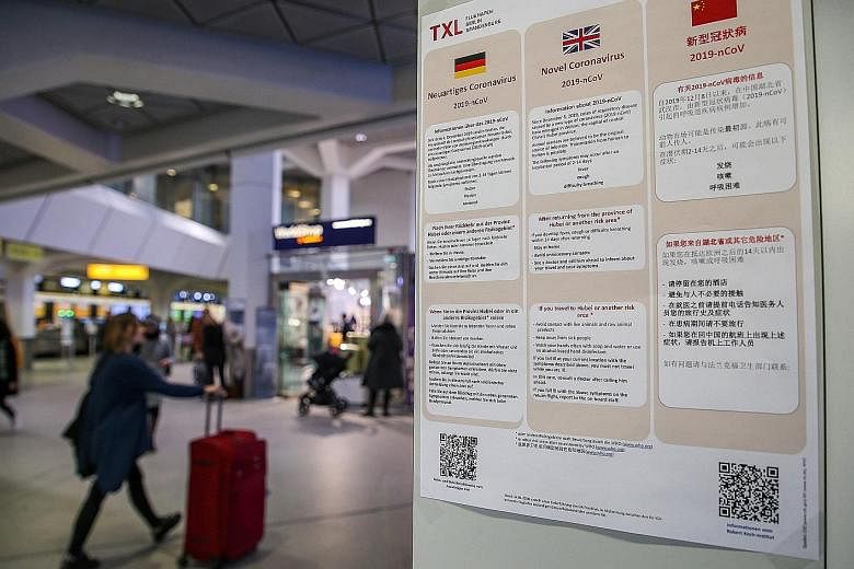 Information on the virus in German, English and Chinese at Berlin's Tegel Airport. The German patient had attended a training session given by his Chinese colleague, who had recently visited the Wuhan region.