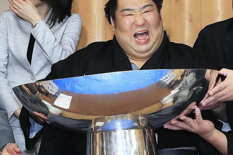 Rank-and-file wrestler Tokushoryu celebrating after winning the New Year Grand Sumo Tournament in Tokyo on Sunday, his first top-division championship.