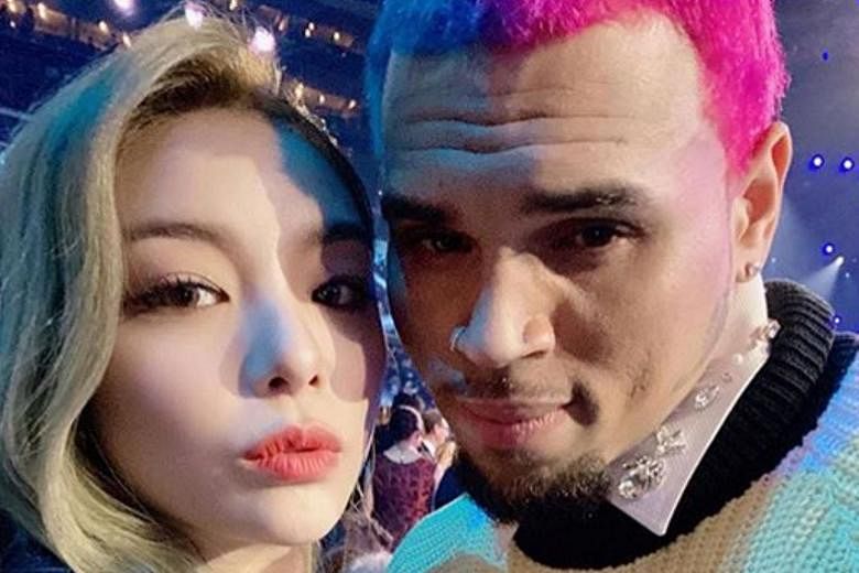 Ailee slammed for posing with Chris who beat up Rihanna in 2009 The Straits