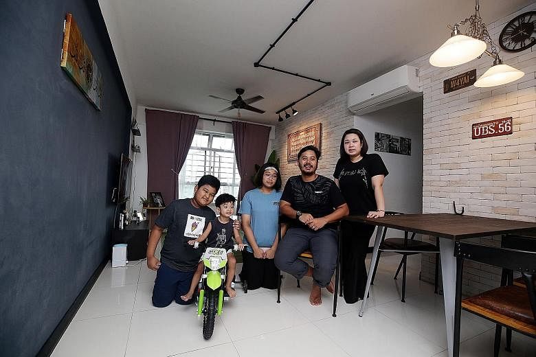 Mr Haikal Aziz, his wife Rashidah Ahmat, daughter Nur Atiqah Natasya (in blue T-shirt) and sons Md Khalish Rizqin and Md Hayyan Rizqin (on bicycle), in their four-room BTO flat in Choa Chu Kang. They are looking to upgrade to an executive flat nearby