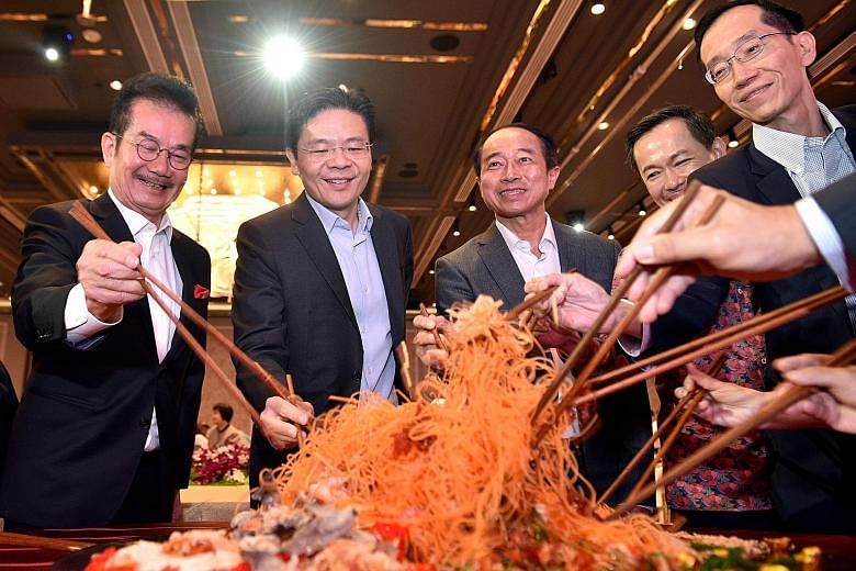 Real Estate Developers' Association of Singapore (Redas) president Chia Ngiang Hong (from left), Minister for National Development Lawrence Wong, Redas past president Augustine Tan, Ministry of Law deputy secretary Calvin Phua and Inland Revenue Auth