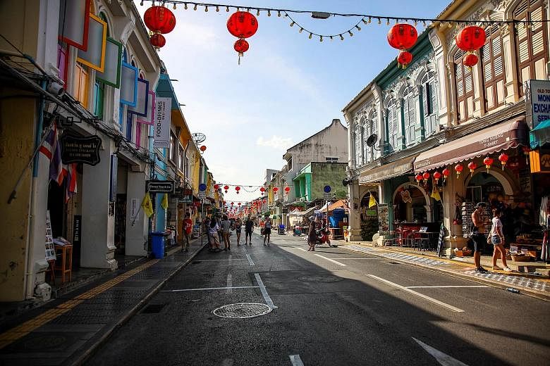 Just a handful of tourists were seen on Friday in a street in Phuket, which is usually bustling with Chinese tourists during the Chinese New Year holiday. PHOTO: REUTERS