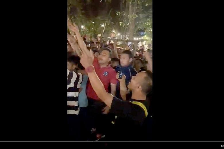 A screengrab of a video showing dozens of young men whom Malaysia's Youth and Sports Minister Syed Saddiq Syed Abdul Rahman said gatecrashed and interrupted his political party's event last Friday night. PHOTO: TEAMSADDIQ/ TWITTER