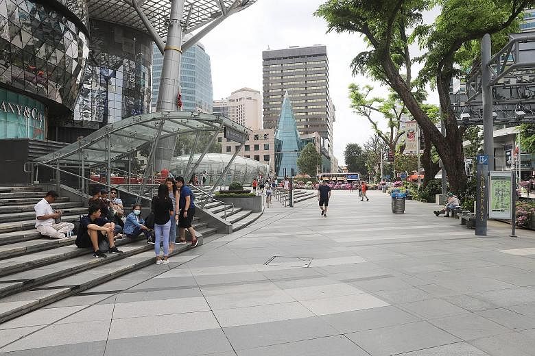 Orchard Road was visibly quieter yesterday, as some appeared to shy away from crowded areas, while those out and about said they enjoyed the relief from weekend crowds. ST PHOTO: MARCELLIN LOPEZ