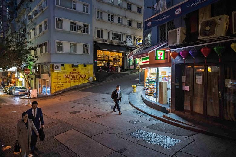 A near-empty Staunton Street in the Central district of Hong Kong yesterday. Hong Kong's retail and tourism sectors rely heavily on spenders from the Chinese mainland, but the city, which has so far seen 15 confirmed cases of the coronavirus, has tak