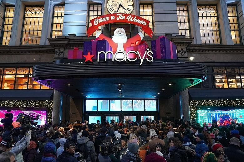 Shoppers crowding a Macy's store in New York on Black Friday last year. The US retailer has struggled with the decline of the once-dominant shopping mall, and competition from Amazon. The company said the savings generated by its plan to streamline o