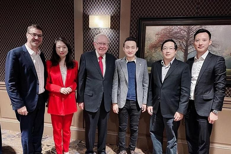 Mr Warren Buffett and Mr Justin Sun (both centre) with (from far left) eToro chief executive Yoni Assia, Binance Charity Foundation head Helen Hai, Litecoin Foundation founder Charlie Lee and Huobi chief financial officer Chris Lee during their meeti