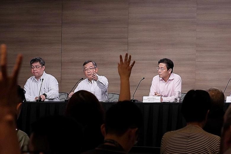 At the multi-ministry task force news conference yesterday were (from left) MOH director of medical services Kenneth Mak, Health Minister Gan Kim Yong, National Development Minister Lawrence Wong and Education Ministry director of schools Liew Wei Li