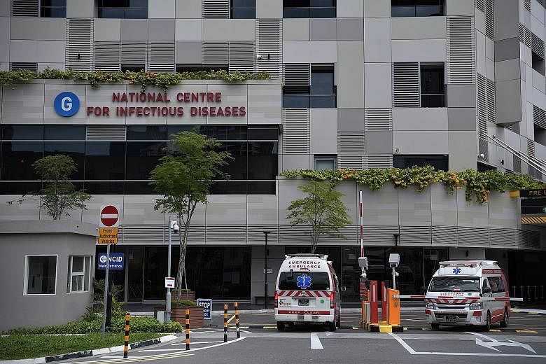 Ambulances at the National Centre for Infectious Diseases at Tan Tock Seng Hospital. The total number of people infected in Singapore has grown to 40. ST PHOTO: KUA CHEE SIONG