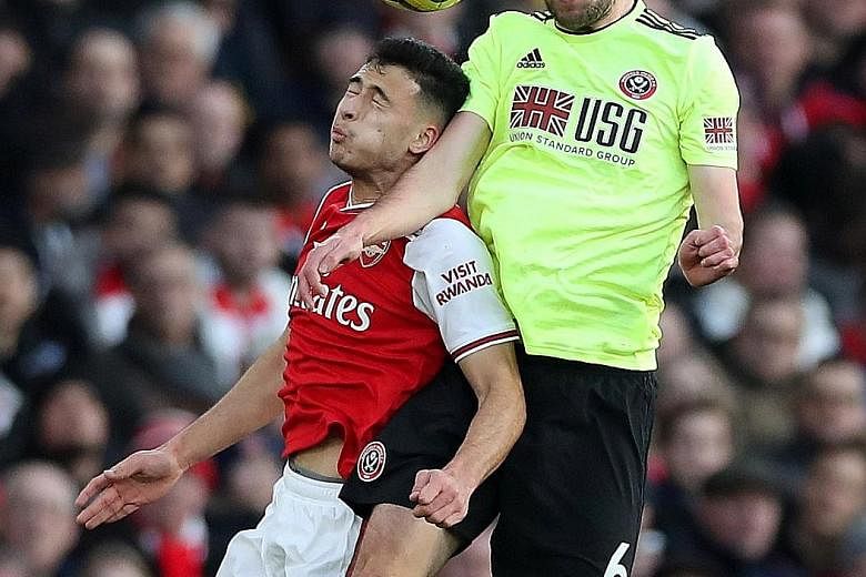 The successful switching of the versatile Chris Basham (outjumping Arsenal's Gabriel Martinelli) from midfield to defence shows that the 52-year-old English manager Chris Wilder has an eye for picking the right players. PHOTO: REUTERS