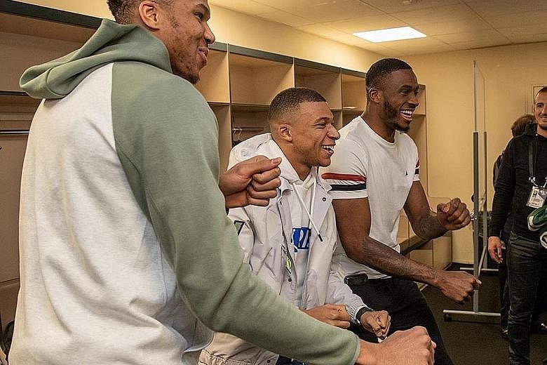 SWEET TWEET "Paris was LIT! What a night @k.mbappe X #PSGWoah" Milwaukee's Giannis Antetokounmpo and his brother Thanasis get their moves on with PSG's hotshot during the Bucks' NBA game in Paris.