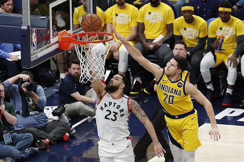 Toronto guard Fred VanVleet taking a shot as Indiana forward Dough McDermott defends during their NBA game at Bankers Life Fieldhouse in Indianapolis. The visitors won 115-106. PHOTO: REUTERS
