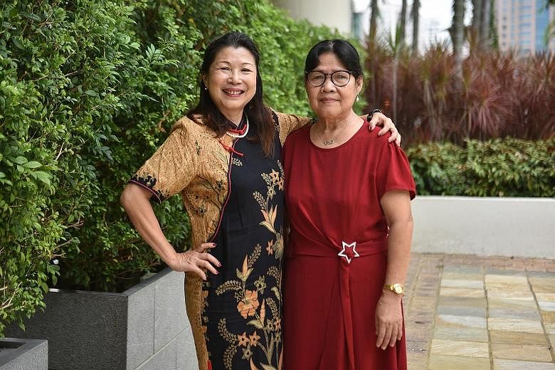 Madam Lim Sok Geok (left) with her helper Edencia Gamueda Antalan, who has worked for the family for 36 years. ST PHOTO: KELLY HUI