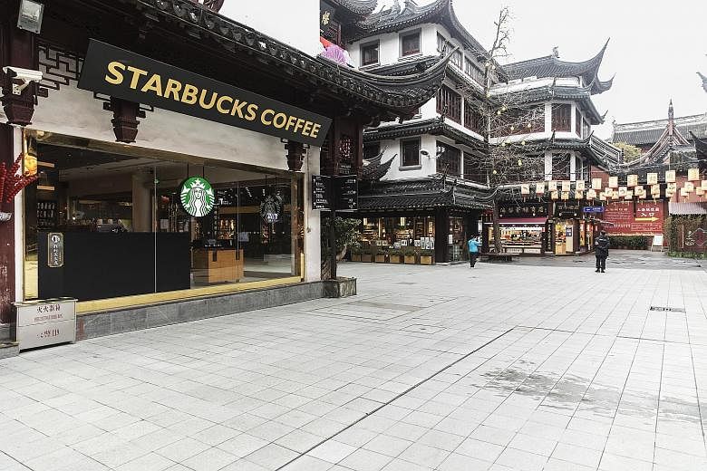 This Starbucks outlet in Shanghai was among those closed on Friday as part of efforts to control the outbreak. PHOTO: BLOOMBERG