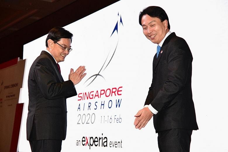 Left: Deputy Prime Minister Heng Swee Keat with Experia Events chairman Vincent Chong at the opening of this year's Singapore Airshow at Marina Bay Sands last night. In his opening speech, Mr Heng said that the virus outbreak has brought uncertainty 