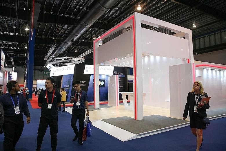 An unoccupied booth on the opening day of the Singapore Airshow, presumably from an exhibitor's withdrawal due to the coronavirus. There was a noticeable drop in crowds at what is billed as Asia's largest aerospace and defence event. Above: An aerial