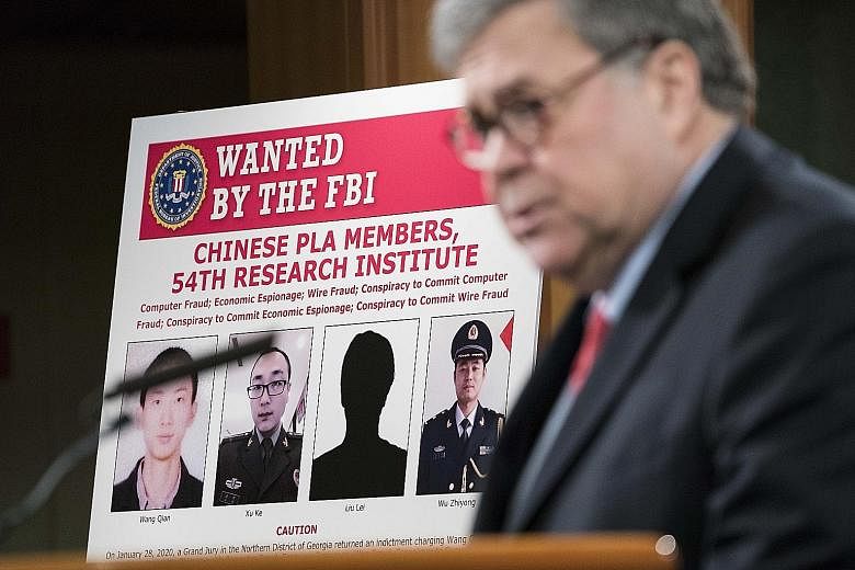 Attorney-General William Barr announced the indictments of the Chinese Liberation Army members in Washington on Monday. PHOTO: AGENCE FRANCE-PRESSE
