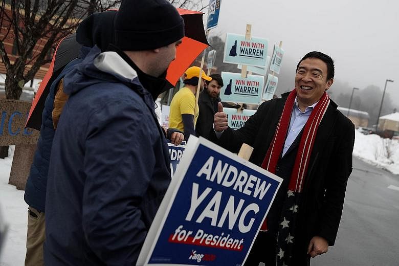 Mr Andrew Yang greeting supporters in Keene, New Hampshire, on Tuesday. His decision to end his bid for the presidency comes after he failed to win any pledged delegates in the Democratic caucuses in Iowa. PHOTO: AGENCE FRANCE-PRESSE