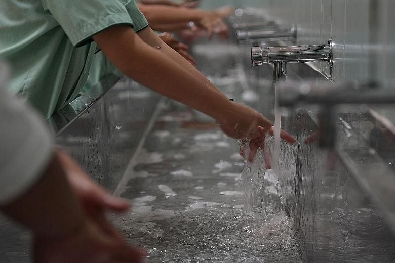 Farrer Park Primary School pupils washing their hands before mealtime. Pulitzer Prize-winning science writer Laurie Garrett says the coronavirus outbreak is a very serious epidemic and perhaps "one of the most serious challenges we have faced in at l