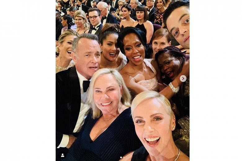THE OBLIGATORY OSCAR WEFIE: Charlize Theron (foreground) did not win a Best Actress Oscar on Sunday, but she made sure she surrounded herself with high achievers. In a wefie that she posted and which has drawn online attention, she and her mother Ger
