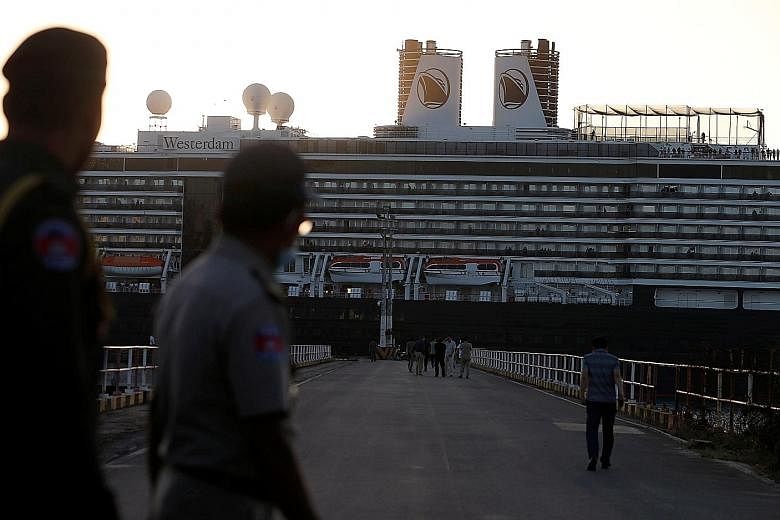 Left: Passengers on the deck of the Diamond Princess, which has the single largest cluster of infected people outside China. Right: The Westerdam arriving in Sihanoukville, on Cambodia's southern coast, yesterday. It had been turned away from several
