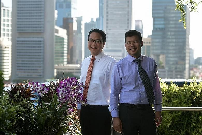 The Ministry of Finance's fiscal policy director Peter Lim (far left) and land and infrastructure programmes director Mark Tan speak about issues such as the Government being able to draw on the nation's reserves only up to a certain point, how incre