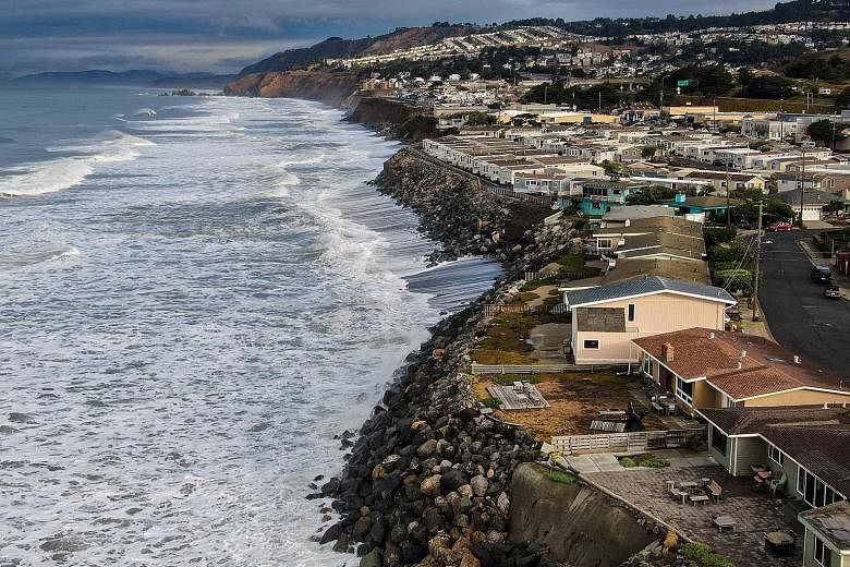 A sea wall (left) surrounding Navotas, a low-lying area of metropolitan Manila, and homes (right) along the coast in Pacifica, California, south of San Francisco. One poor, one rich, Manila and San Francisco face a similar dilemma.