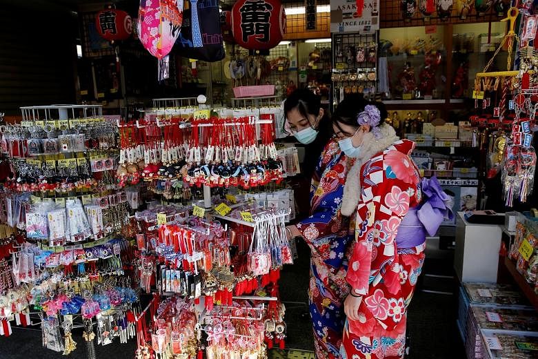 Tourists in kimonos at a souvenir shop in Tokyo late last month. Japan is expecting its biggest economic contraction since 2014 for the October-December quarter last year, and some analysts expect its economy to suffer another contraction in the curr