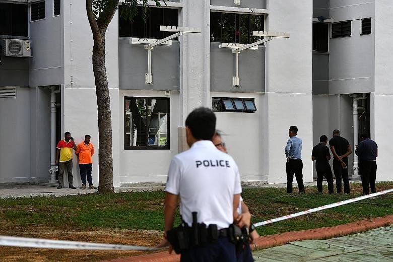 Police officers investigating the area at Block 534 Bedok North Street 3, where the baby boy was found abandoned in a rubbish bin chute by cleaners on Jan 7.