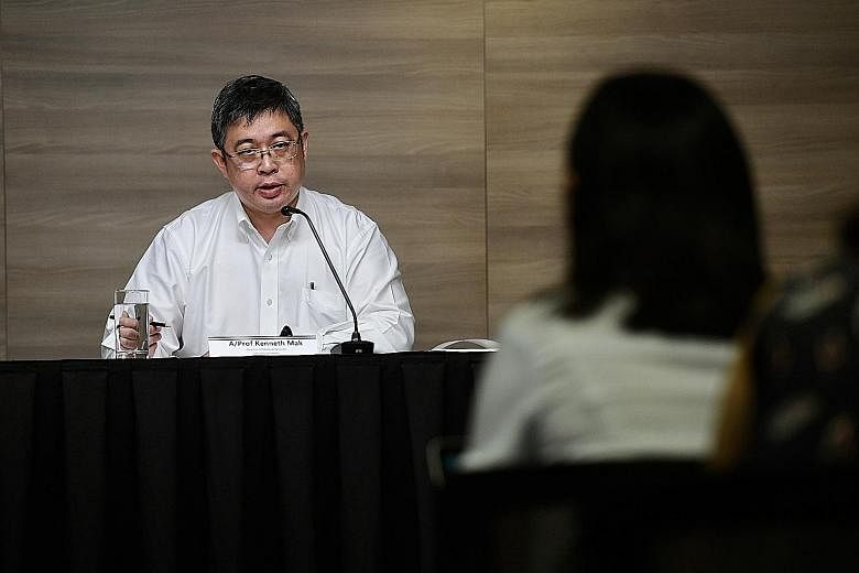 Ministry of Health director of medical services Kenneth Mak speaking to the media on Friday. Associate Professor Mak, a surgeon by training, took up the post only at the start of this month.