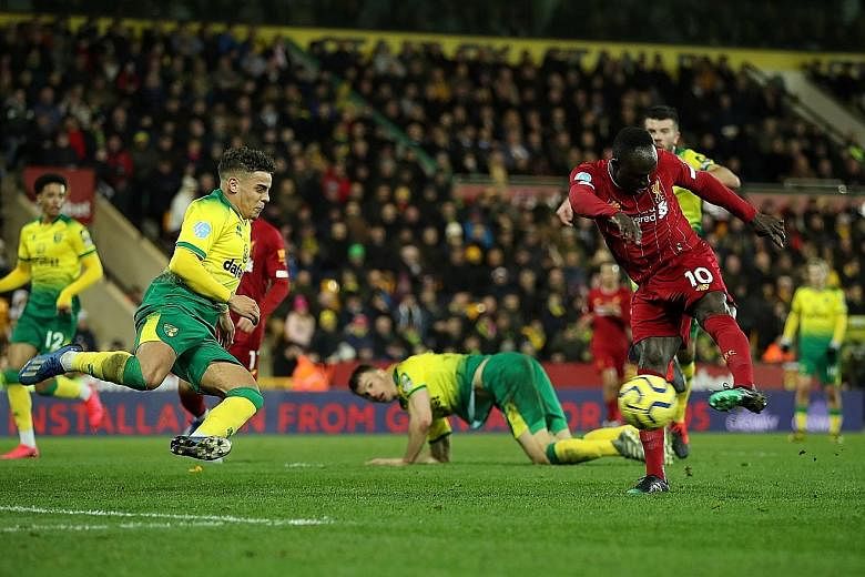 Liverpool substitute Sadio Mane rifling home to break the deadlock with what proved to be the match-winner against Norwich at Carrow Road in the Premier League on Saturday. It was his 100th goal in English football. PHOTO: REUTERS