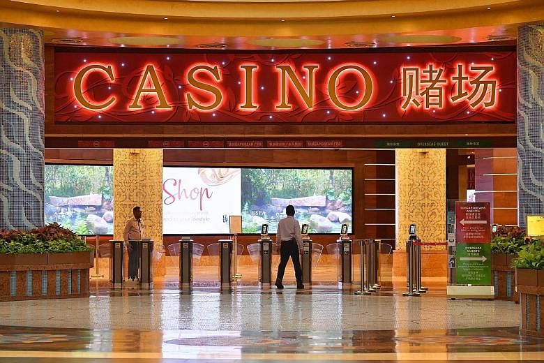 At Resorts World Sentosa's casino (above), visitorship has dived amid the coronavirus outbreak. It has implemented measures such as regular disinfection of gaming chips, tables and slot machines. ST PHOTO: CHONG JUN LIANG