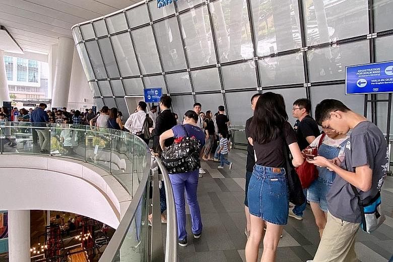 Temperature-screening measures were in place at New Creation Church in Buona Vista, where many attended its services. ST PHOTO: GAVIN FOO It was a quiet Sunday at the Church of St Alphonsus in Novena yesterday, with public mass for Catholics in Singa
