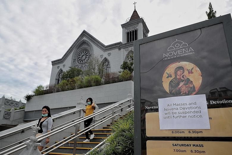 Temperature-screening measures were in place at New Creation Church in Buona Vista, where many attended its services. ST PHOTO: GAVIN FOO It was a quiet Sunday at the Church of St Alphonsus in Novena yesterday, with public mass for Catholics in Singa