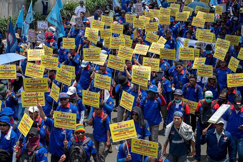 Indonesian workers protesting in Jakarta last week against a government plan to loosen the country's strict labour laws. President Joko Widodo, fresh from last year's landslide re-election victory, is seizing on his political capital to push through 