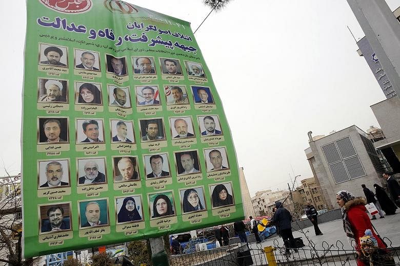 An electoral billboard in Teheran. Iranians are in a gloomy mood ahead of Friday's parliamentary election, exhausted by a succession of crises including Iran's confrontation with the US.
