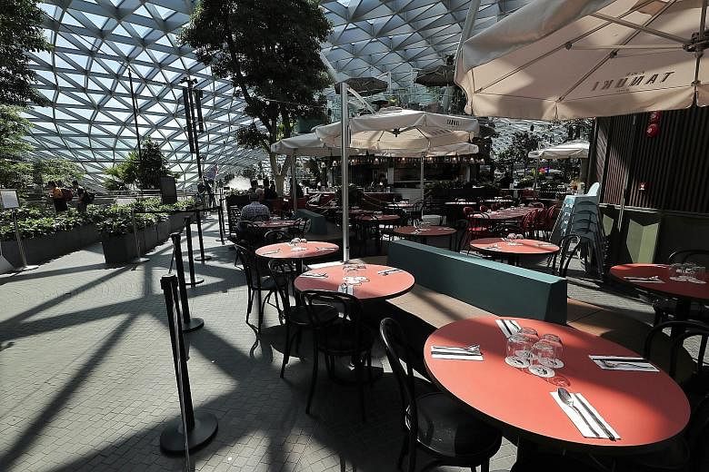 A picture taken on Feb 13 of almost empty eateries at Jewel Changi Airport. Tourism and aviation are among the five sectors most directly hit by the coronavirus outbreak and the Government will implement measures, including reskilling and redeploymen