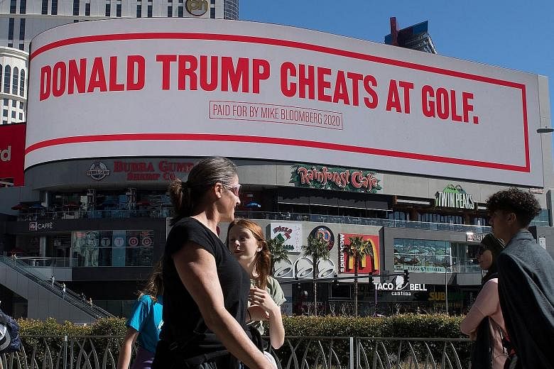 One of the slogans on the giant digital billboard paid for by Democratic presidential hopeful Michael Bloomberg and displayed near the hotel where US President Donald Trump is staying while in Las Vegas. PHOTO: AGENCE FRANCE-PRESSE