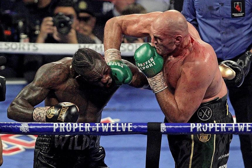 Tyson Fury landing a right to the face of Deontay Wilder during their heavyweight title bout in Las Vegas. The Briton landed 82 of 267 punches as his rival's corner threw in the towel in the seventh round. 