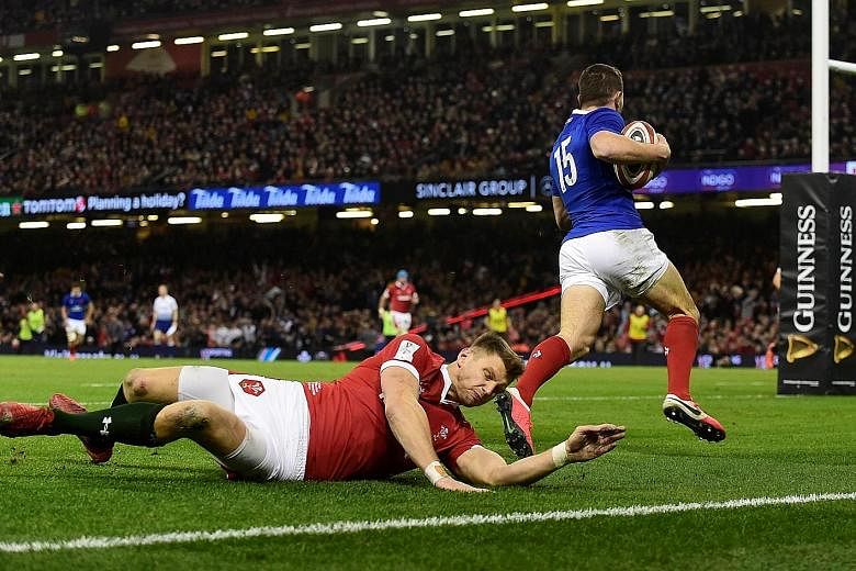 Anthony Bouthier scoring France's first try in their 27-23 win. The visitors held firm against Wales' second-half fightback to stay top of the Six Nations standings with three wins. 