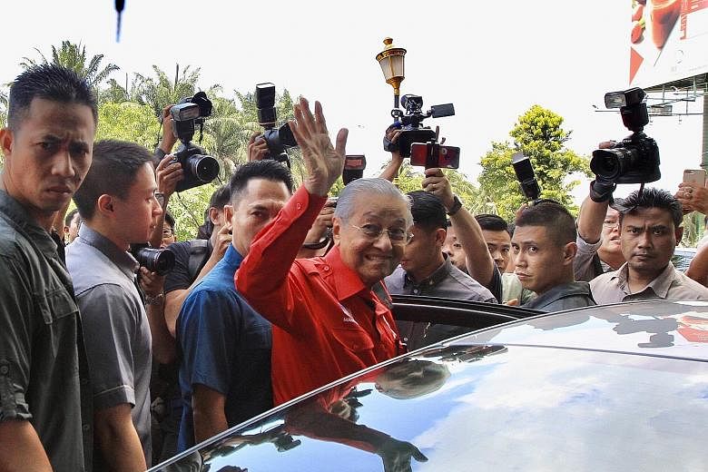Malaysian Prime Minister Mahathir Mohamad leaving his party's headquarters yesterday in Petaling Jaya, Selangor, after a meeting. Speculation of the imminent collapse of the PH government peaked yesterday when local media reported that leaders from T