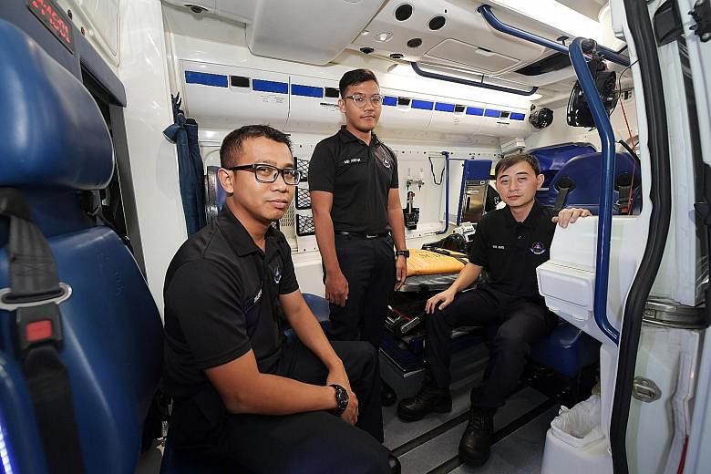 The ambulance team comprising SCDF officers (from left) Zulkifli Arsarapi, Muhammad Arfan Mohammad Shahrom and Ian Ang Wei Lee have been attending to cases of potential coronavirus patients. ST PHOTO: ALPHONSUS CHERN