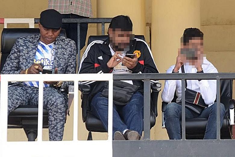 Sofapaka Football Club's chairman Elly Kalekwa (far left), with two Singaporeans who claimed to represent a Hong Kong firm, watching the club's maiden game on Aug 30 last year for the 2019/2020 season. Although large sums were promised as part of a s