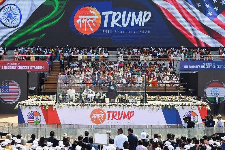 United States President Donald Trump speaking at the "Namaste Trump" rally, with India Prime Minister Narendra Modi and First Lady Melania Trump with him on stage, at Sardar Patel Stadium in Motera, Ahmedabad, yesterday. PHOTO: AGENCE FRANCE-PRESSE