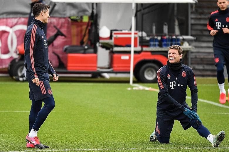 Robert Lewandowski (left) has scored 38 goals in all competitions for Bayern Munich this season and many of those have been with the help of Thomas Muller, who has 14 assists. PHOTO: EPA-EFE