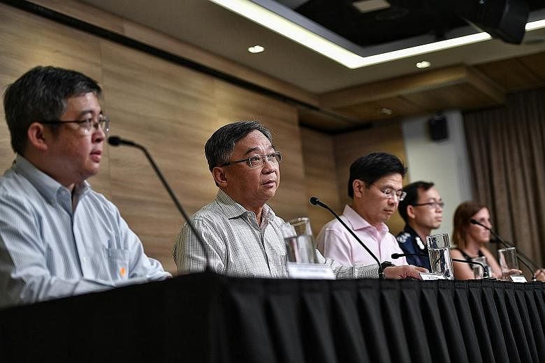 The multi-ministry task force on the coronavirus, including (from left) the Health Ministry's director for medical services Kenneth Mak, Minister for Health Gan Kim Yong and task force co-chair Lawrence Wong, giving updates at a press conference yest