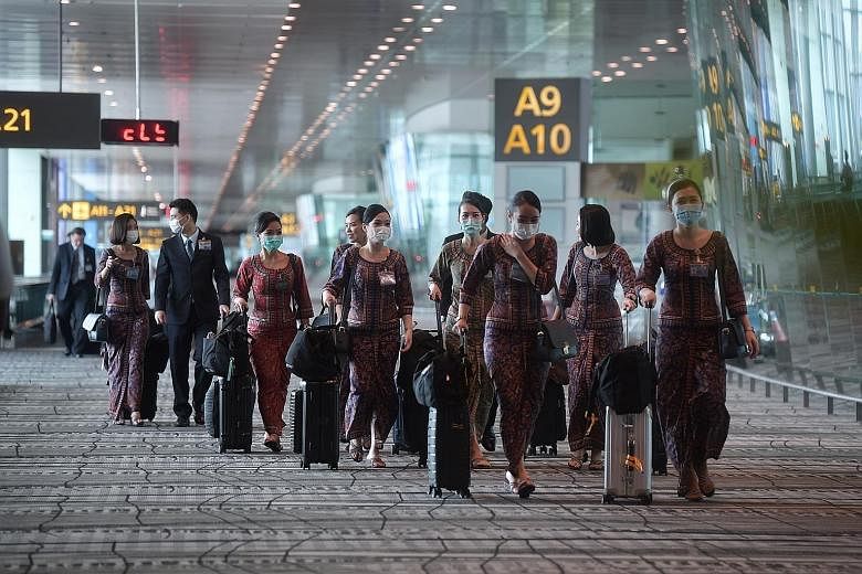 Singapore Airlines has excess manpower of more than 500 cabin crew members and about 50 pilots following three rounds of flight cuts. ST PHOTO: KUA CHEE SIONG