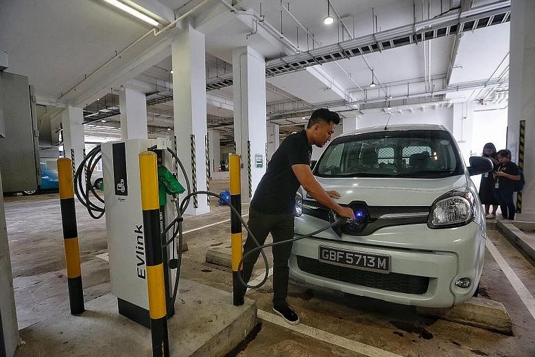 An electric vehicle being charged. Mr Yee Chia Hsing (Chua Chu Kang GRC) said the Government should encourage distributors to bring in more EV models and proposed an additional tax deduction for bringing them in.