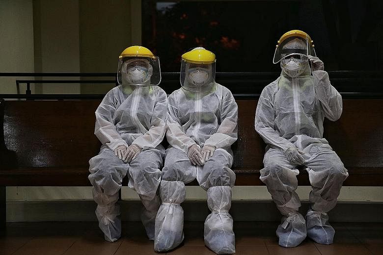 Employees from a cleaning company taking a break after disinfecting a site. Silver Ribbon executive director Porsche Poh said some people have become highly anxious about catching the coronavirus.